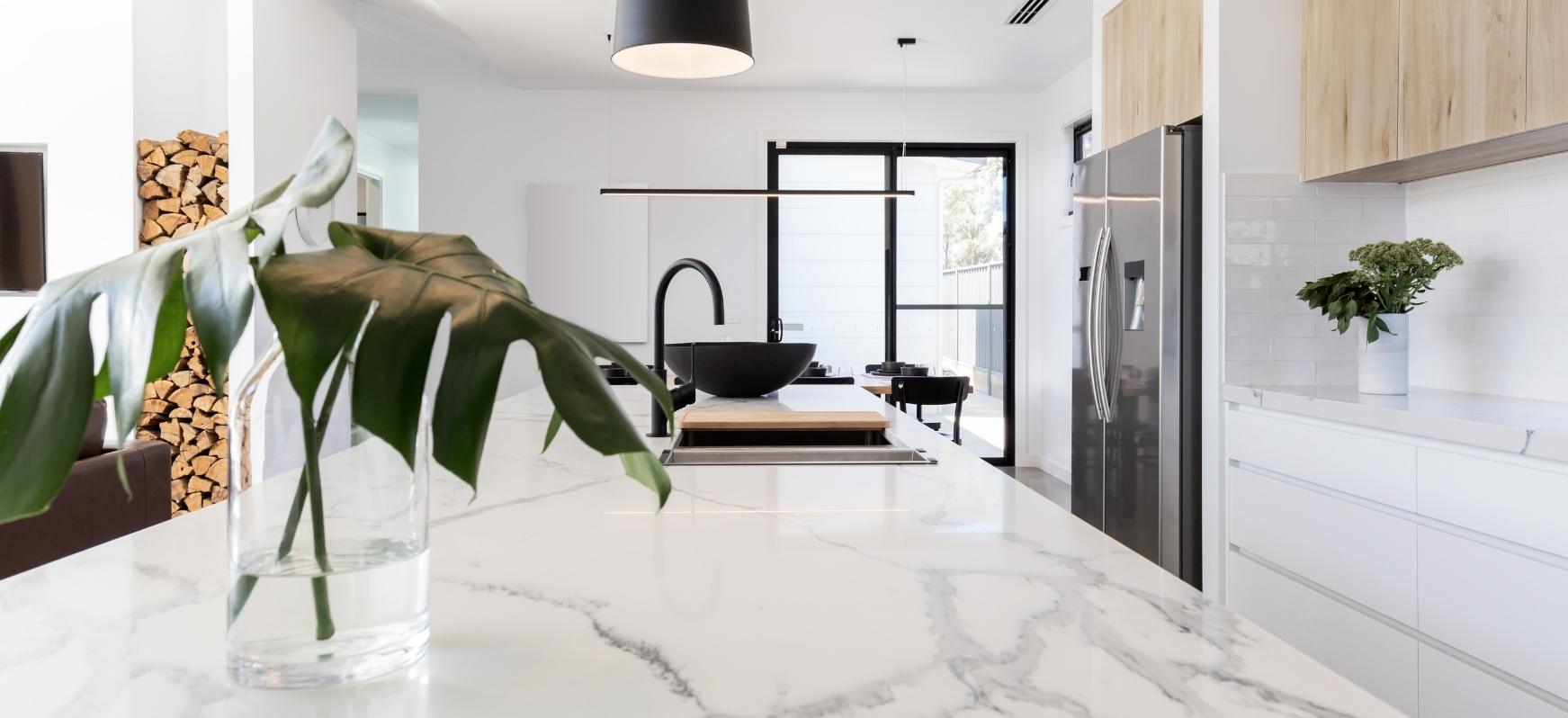 White Marble Kitchen Countertops with Marble Island and Matte Black Stainless Steel Faucet Natural Stone Countertops