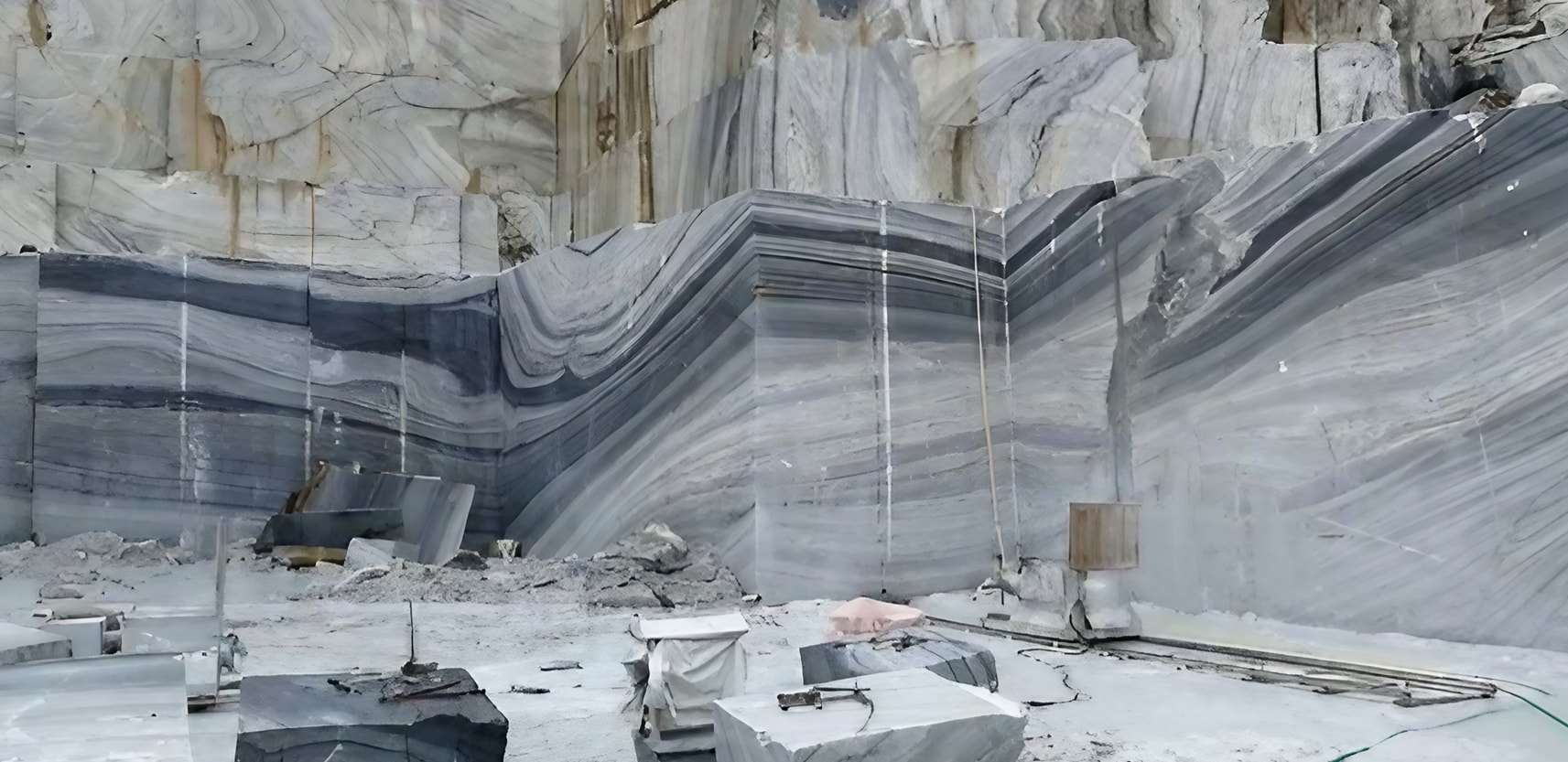The Blue Danube Marble Quarry, situated in Jiangsu China, is renowned for its exquisite Blue Danube Marble. This marble boasts a captivating blue-gray color with distinct veining, reminiscent of flowing water. The quarry's blend of ancient techniques and modern precision allows skilled artisans to extract and transform the marble into elegant slabs that showcase its natural beauty. Blue Danube Marble finds application in diverse areas, from architecture to interior design, adding depth and sophistication. A visit to the quarry offers a chance to witness the harmony of nature and human creativity, as each marble slab embodies the surroundings and craftsmanship. The quarry stands as a testament to the enduring connection between Earth's treasures and artistic innovation, capturing the allure of blue-gray hues and the artistry that shapes them into enduring works of elegance. 