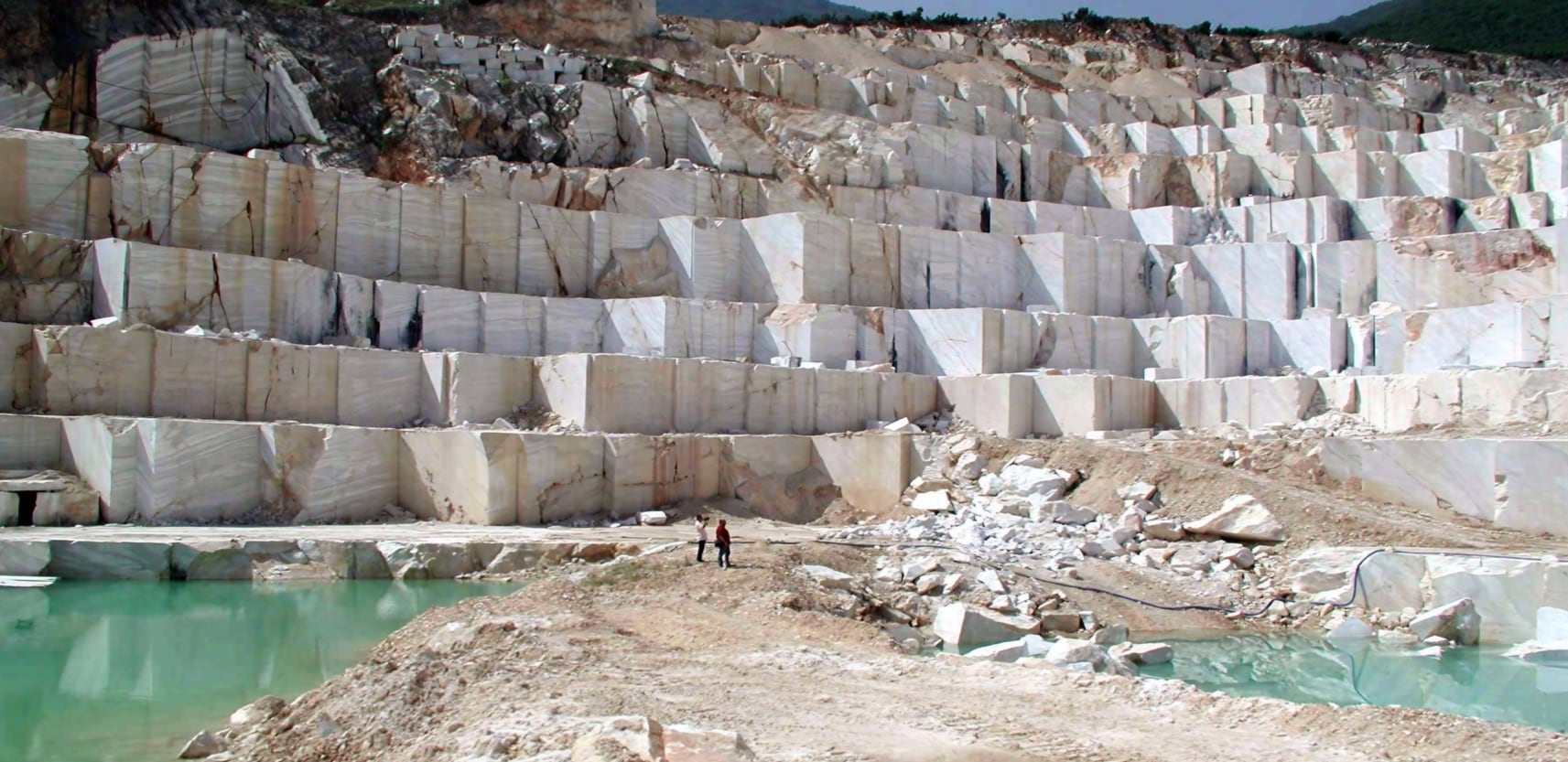 The Thassos Marble Quarries on the Greek island of Thassos are a testament to the fusion of natural splendor and human artistry. They produce the renowned Thassos Marble, known for its crystalline white beauty. This marble reflects sunlight, creating a captivating interplay of light. The extraction process combines skilled craftsmanship and natural elegance, resulting in marble blocks and slabs that have adorned architectural marvels throughout history. Visiting these quarries is a journey into the intertwining realms of geological wonder and creative human endeavor, where Thassos Marble's allure stands as a symbol of timeless elegance and the enduring connection between art and nature.