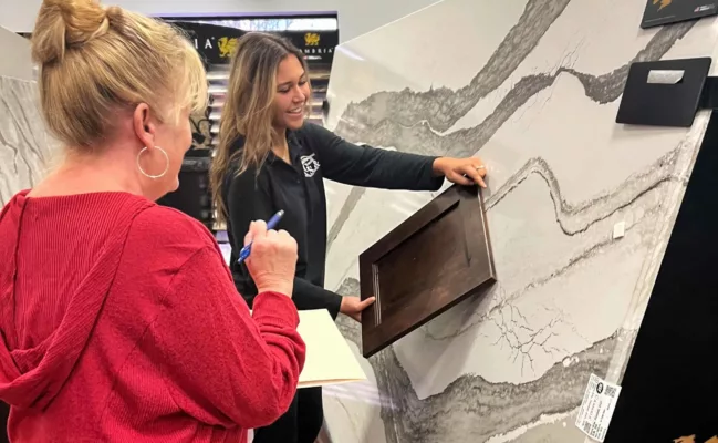 Customer in showroom being helped square optimized scaled e1709848609412 | Countertops